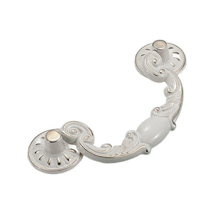 White and silver-tone ornate bail pull with scrollwork and round mounting plates, option No. 6.