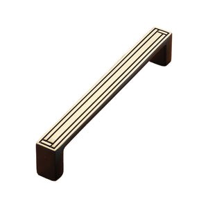 Black bar pull with linear gold-tone inlay, 128 mm, option No. 7.