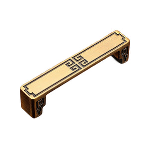 Bronze-tone straight bar pull with a Greek key center detail, option No. 22, 96 mm.