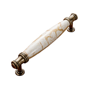 Antique bronze-tone bar pull with a white marble-look barrel grip, option No. 6, 128 mm.