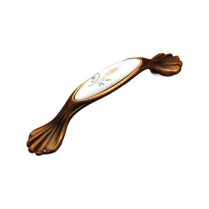 Brown bar pull with a white oval floral insert and fluted ends, option No. 20, 128 mm.