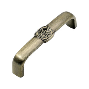 Curved bar pull with a circular medallion at the center, variant #17, 96 mm.
