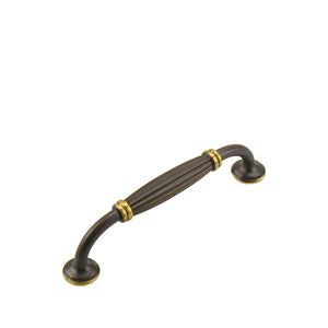 Coffee-tone arched bar pull with a ribbed center and gold-tone rings, 128 mm.