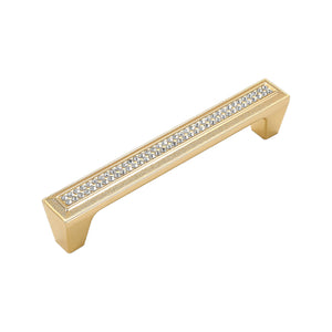 Gold-tone bar pull with a clear faceted inlay, 128 mm, option No. 3.