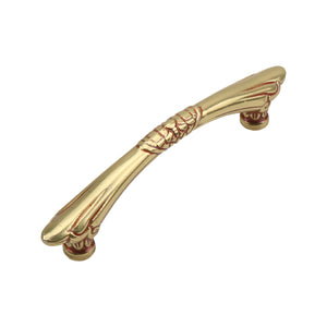 Gold-tone curved bar pull with a patterned center band, option No. 3, 135 mm.