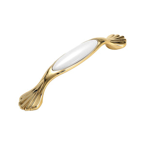 Gold-tone bar pull with a white oval ceramic inset and fan-shaped ends, option No. 1, 128 mm.
