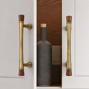 Bronze-finish cabinet bar pulls with dark wood ends installed on white cabinet doors.