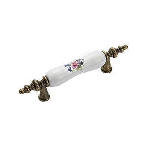 Bar pull with a white floral-print grip and ornate bronze-tone ends, option #7, 76 mm.