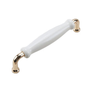 Bar pull with a white tapered grip and gold-tone end mounts, 128 mm.