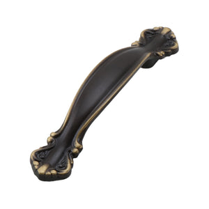 Antique bronze-tone curved bridge pull with sculpted scalloped ends, 64 mm, option No. 3.