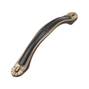 Black curved bridge pull with gold-tone leaf-shaped ends, option No. 4, 96 mm.