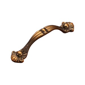 Bronze-tone curved bridge pull with a center collar and sculpted floral ends, option No. 19, 96 mm.