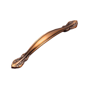 Bronze-tone curved bridge pull with ornate leaf-shaped ends, option No. 9, 128 mm.