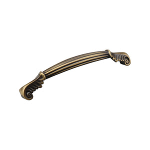 Coffee bronze arched bridge pull with a fluted bar and scroll ends, 140 mm.
