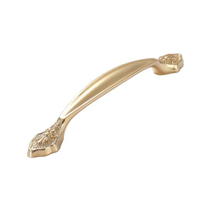 Curved gold-tone bridge pull with ornate ends, 165 mm, option No. 3.