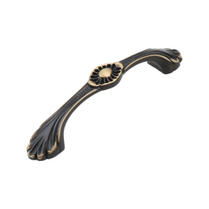 Dark antique-tone arched bridge pull with a floral center and fan-shaped ends, 96 mm, option No. 10.