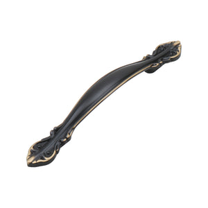 Dark antique-tone arched bridge pull with floral ends, 128 mm, option No. 13.
