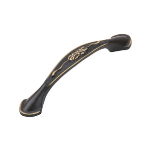 Dark antique-tone arched bridge pull with a gold-tone leaf center, 96 mm, option No. 11.