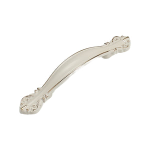 White slender arched bridge pull with floral end details, option No. 10, 64 mm.