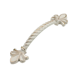 White bridge pull with a twisted grip and fleur-de-lis end details, option No. 8.