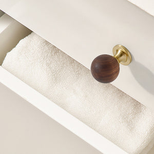 In-use view of dark wood ball cabinet knob on a brass pedestal, style #1 (30 mm).