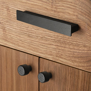 Round black-finish oak wood cabinet knob, style #1 fitted to cabinetry.