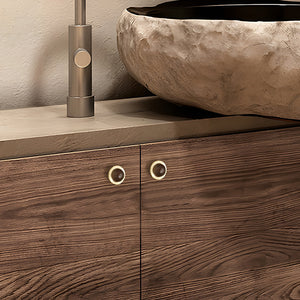 In-use view of brass half-dome cabinet knob with a dark wood inset, style #2.