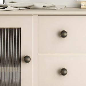 In-use view of shallow cupped antique bronze brass cabinet knob, style #20.