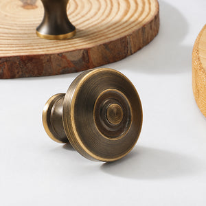 Side and mounting view of concentric-ring antique bronze brass cabinet knob, style #23.