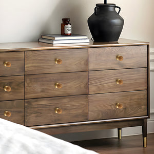 In-use view of light wood ball cabinet knob on a brass pedestal, style #3.