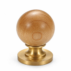 Light wood ball cabinet knob on a brass pedestal, style #3.