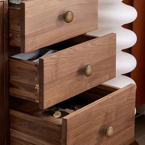 In-use view of rounded walnut wood mushroom cabinet knob, style #3.