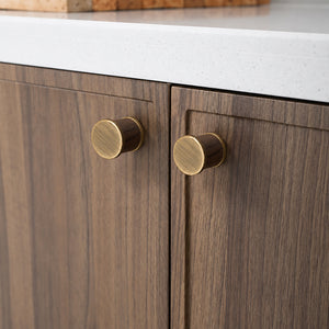 In-use view of dark wood barrel cabinet knob with bronze-finish end caps, style #7 Bronze.