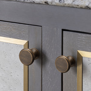 Bronze-finish solid brass round cabinet knob, style #8 shown in a styled setting.