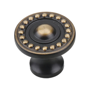 Black round cabinet knob with a gold-tone beaded ring and raised center, option No. 4.
