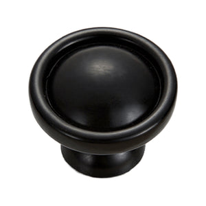 Black round cabinet knob with a recessed circular face, option No. 5.