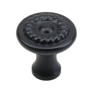 Black round cabinet knob with raised floral detail around the center, option No. 3.