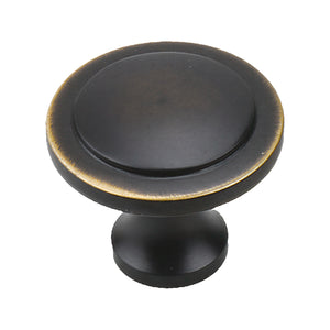 Black round cabinet knob with a flat face and gold-tone rim, option No. 5.
