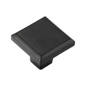 Black square cabinet knob with a flat top and stepped edge, option No. 6.