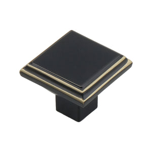 Black square cabinet knob with gold-tone trim, option No. 1, 33 mm.