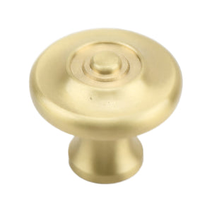 Brass-tone round cabinet knob with concentric rings and a raised center, option No. 1.