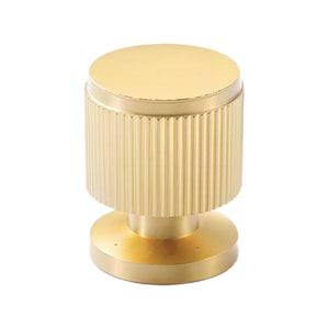 Brass-tone cylindrical cabinet knob with a vertical fluted grip and flat top, option No. 5.
