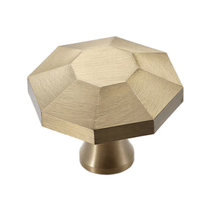 Brass-tone low faceted cabinet knob with a small flat center, option No. 4.