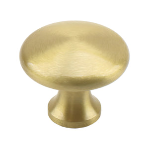 Brass-tone low round cabinet knob with a softly domed top, option No. 4.
