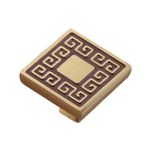 Brass-tone square cabinet knob with a Greek key border, option No. 3.