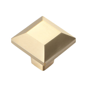 Brass-tone square cabinet knob with a raised faceted top, option No. 5.