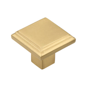 Brass-tone square cabinet knob with a stepped face, 33 mm.