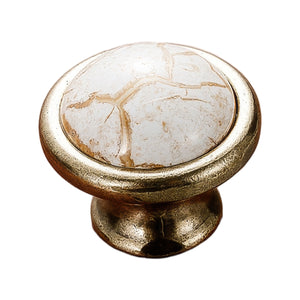 Antique bronze-tone oval cabinet knob with a white marble-look top, option No. 2.