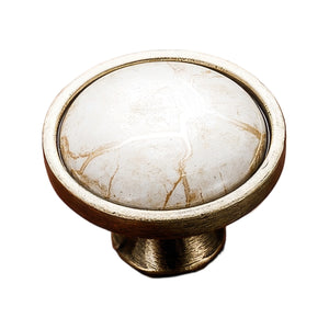 Antique bronze-tone round cabinet knob with a white marble-look top, option No. 1.
