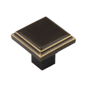 Brown square cabinet knob with a stepped face and gold-tone edging, 33 mm.